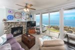 The Pointe, Coastal Decor and Glass in Living Room with River Rock Fireplace